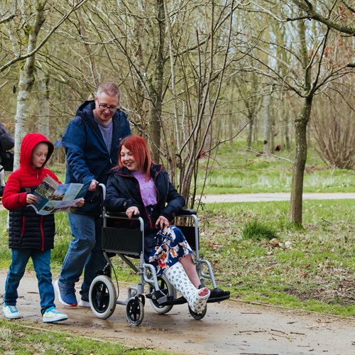 Family participating in an outdoor trail
