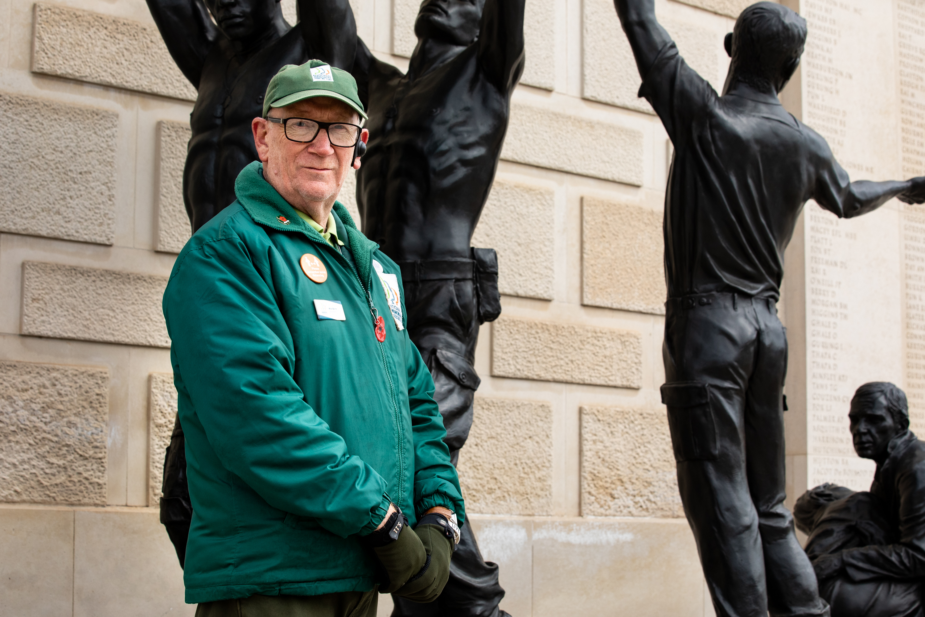 Volunteer Mick Byrne stands at the Armed Forces Memorial.
