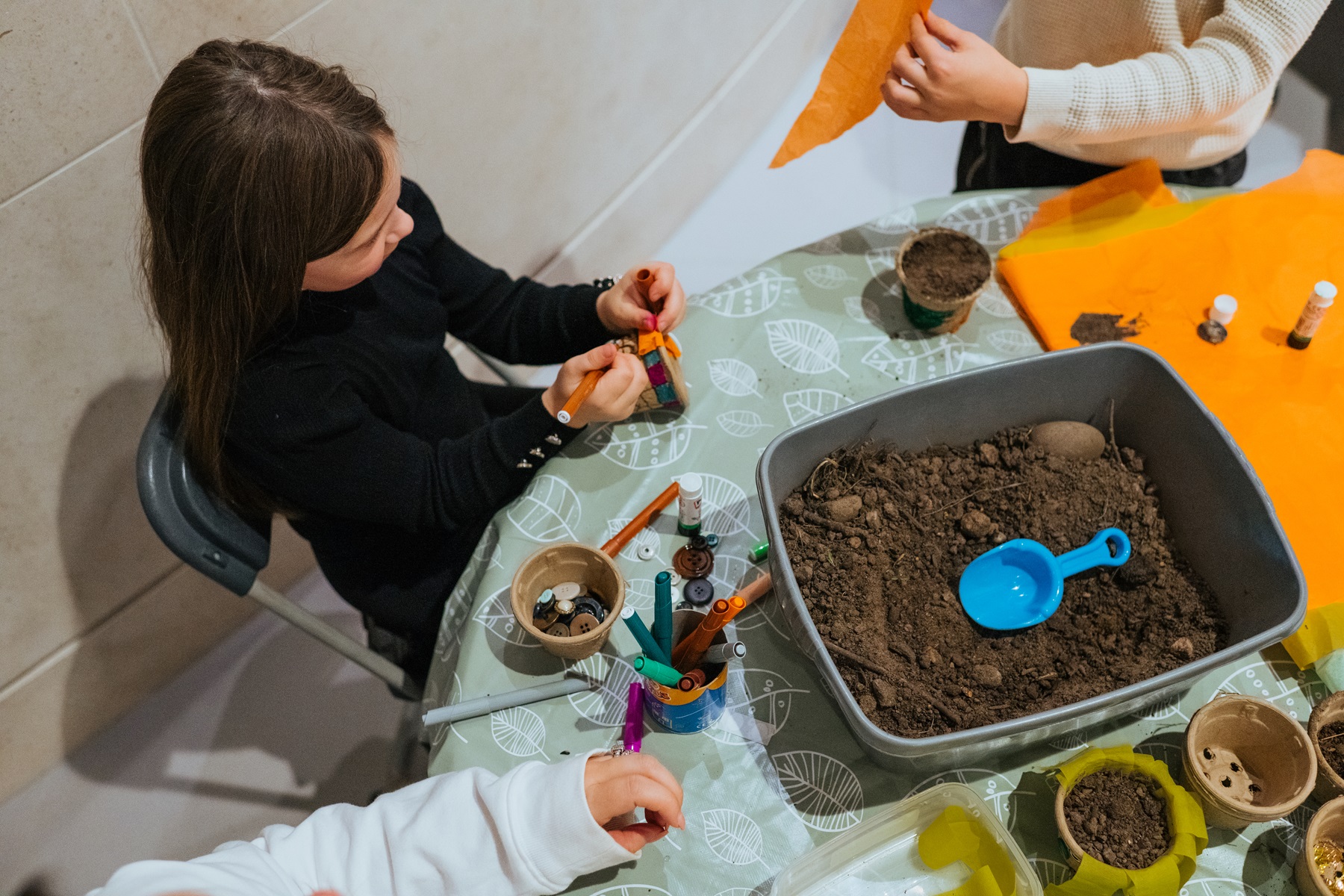 Image of young people planting seeds during easter craft activities